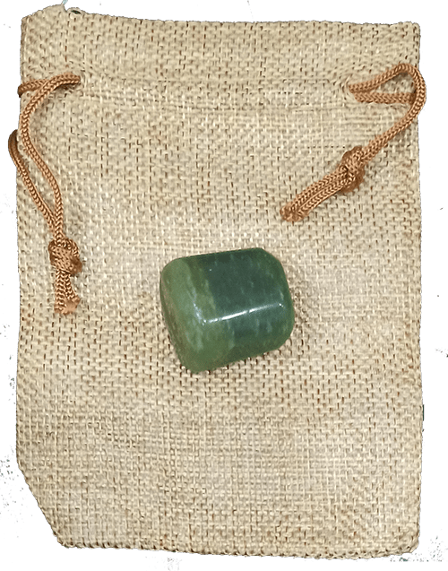 Green aventurine palm stone shown held in the hand for scale