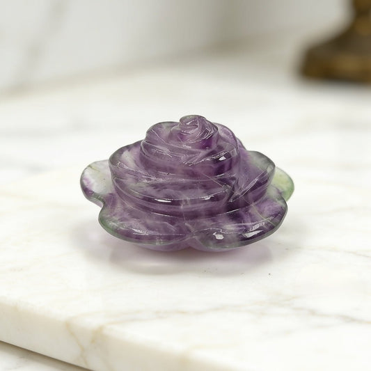 natural amethyst flower stone geode on a plain background