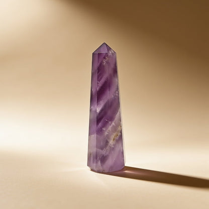 Amethyst obelisk detail showing the colour zoning through the polished point