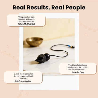 black-coated brass pendulum suspended above a dowsing chart
