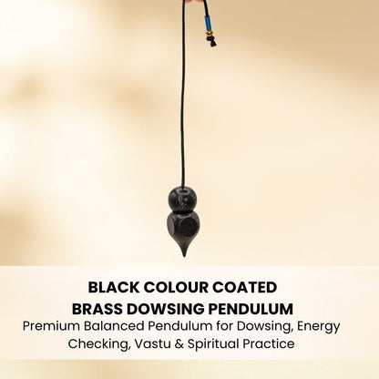 black-coated brass dowsing pendulum resting in the palm for scale
