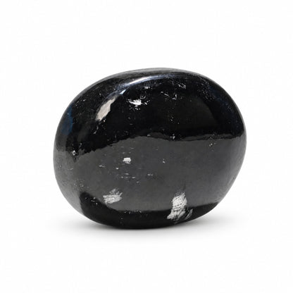 Black Tourmaline stone soap working into a rich, gentle cleansing lather with water under a stream of running water