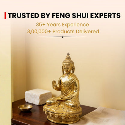 brass Blessing Buddha statue held in hand for scale