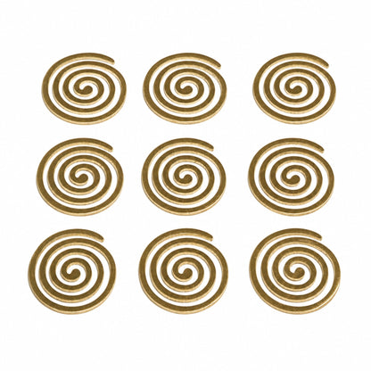 Detailed macro shot of authentic cast brass metal surface showing warm golden polish, concentric spiral ridges, and lustrous metallic finish