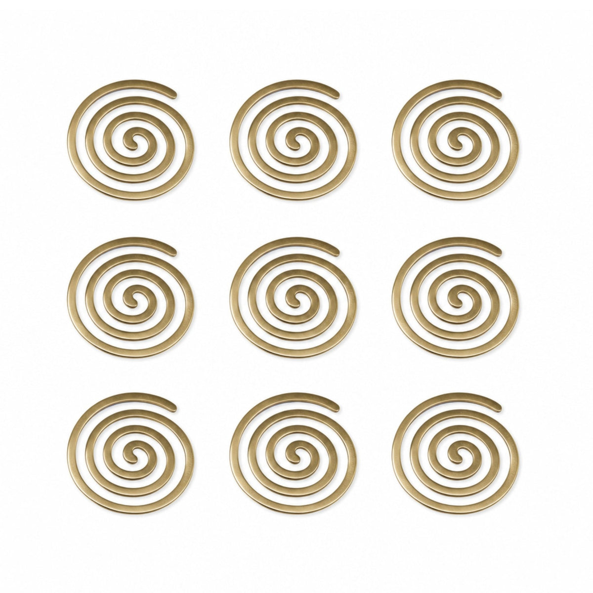 Detailed macro view showing heavy cast brass metal surface, rich golden polish, rounded spiral contours, and smooth edges