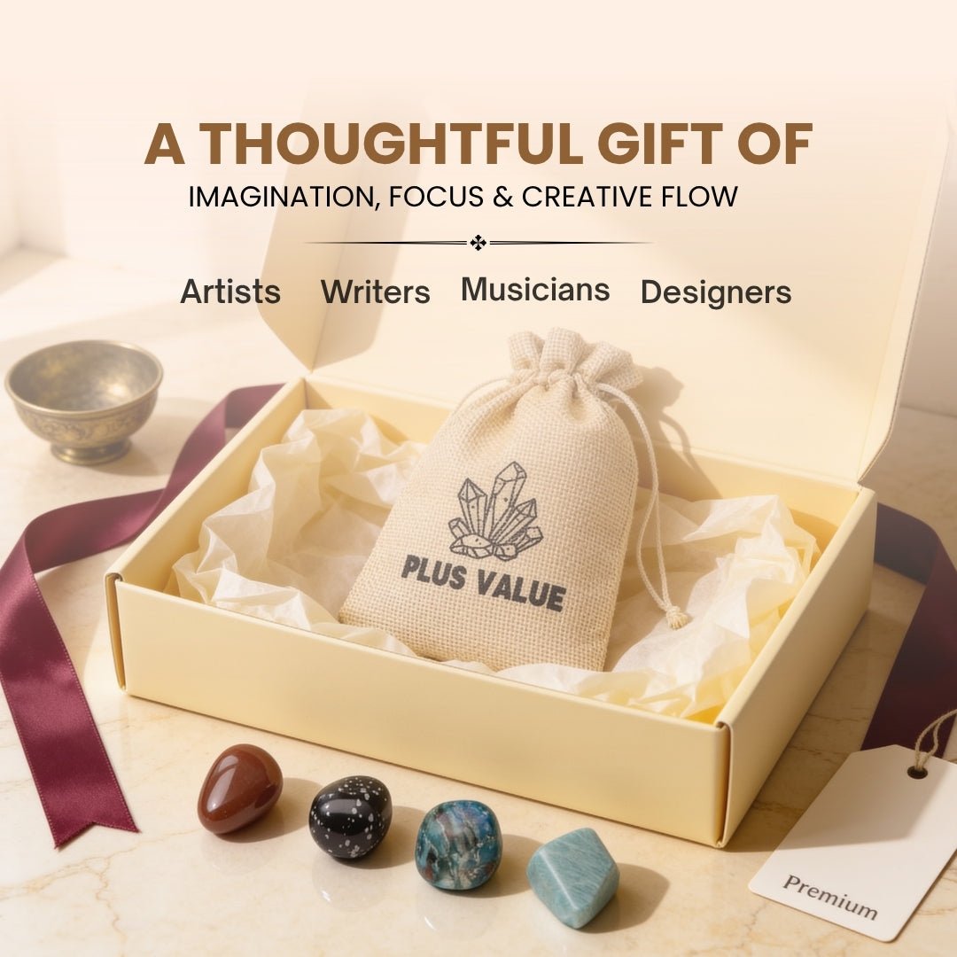 Pocket creative crystals placed next to paintbrushes and sketchpad in art studio