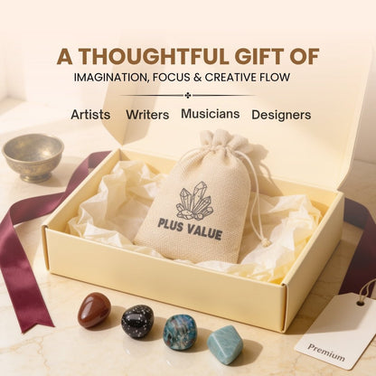 Pocket creative crystals placed next to paintbrushes and sketchpad in art studio