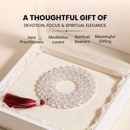 Clear Quartz faceted mala held in fingers during mantra chanting meditation
