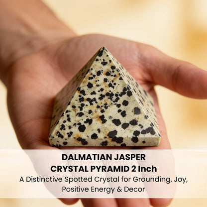 Dalmatian Jasper pyramid placed on an office work desk for grounding and focus