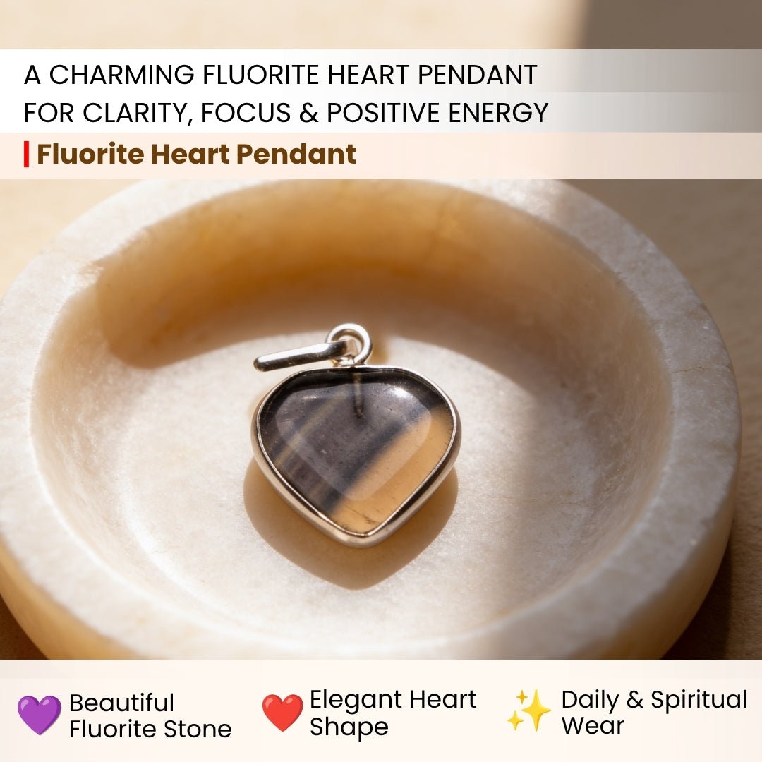 Close-up of natural green, purple, and clear color bands in polished Fluorite heart