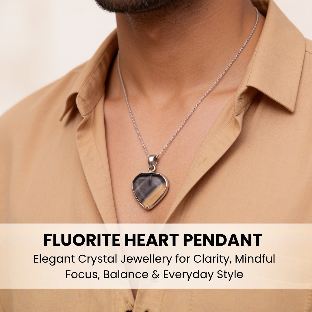 Rainbow Fluorite heart pendant resting gracefully on collarbone for scale
