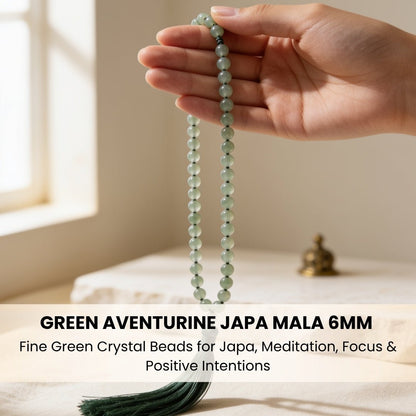 Polished guru bead and matching green silky tassel finish on japa mala