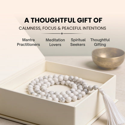 Large 10 mm White Howlite mala held in hand during Crown Chakra mantra chanting