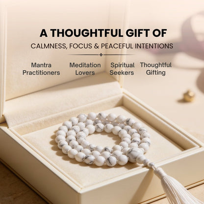 6 mm White Howlite mala held in fingers during calming mantra chanting and mindfulness practice