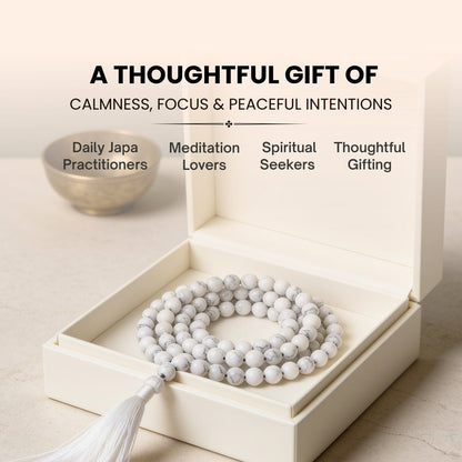8 mm White Howlite mala held in fingers during calming mantra chanting and stress-relief meditation