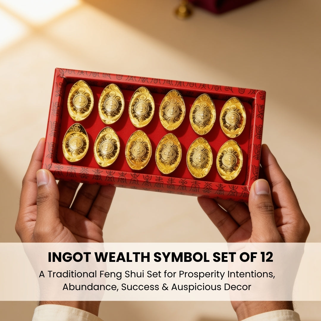 Group of miniature golden Yuan Bao ingots held in palm for size comparison