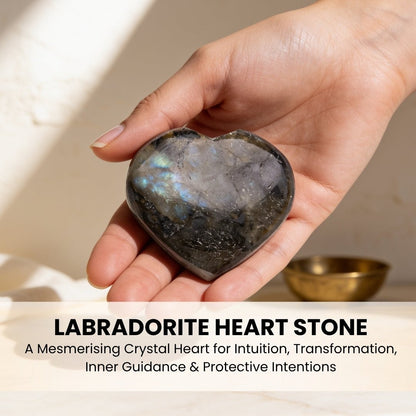 Carved Labradorite heart stone held in palm for handheld meditation and tactile comfort