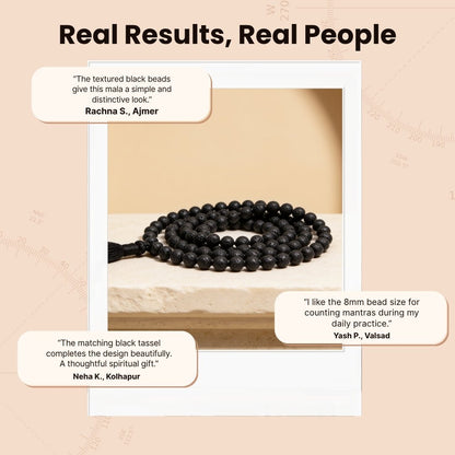 Overhead spiral arrangement of 108 black volcanic Lava beads beside a protective storage pouch