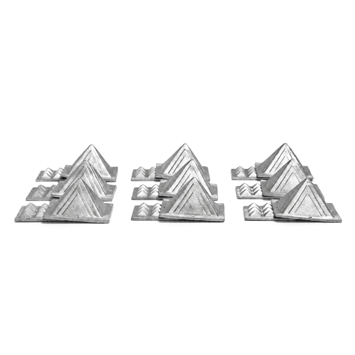 2.5-inch heavy lead pyramid resting in hand demonstrating substantial weight, dense metal feel, and tabletop scale