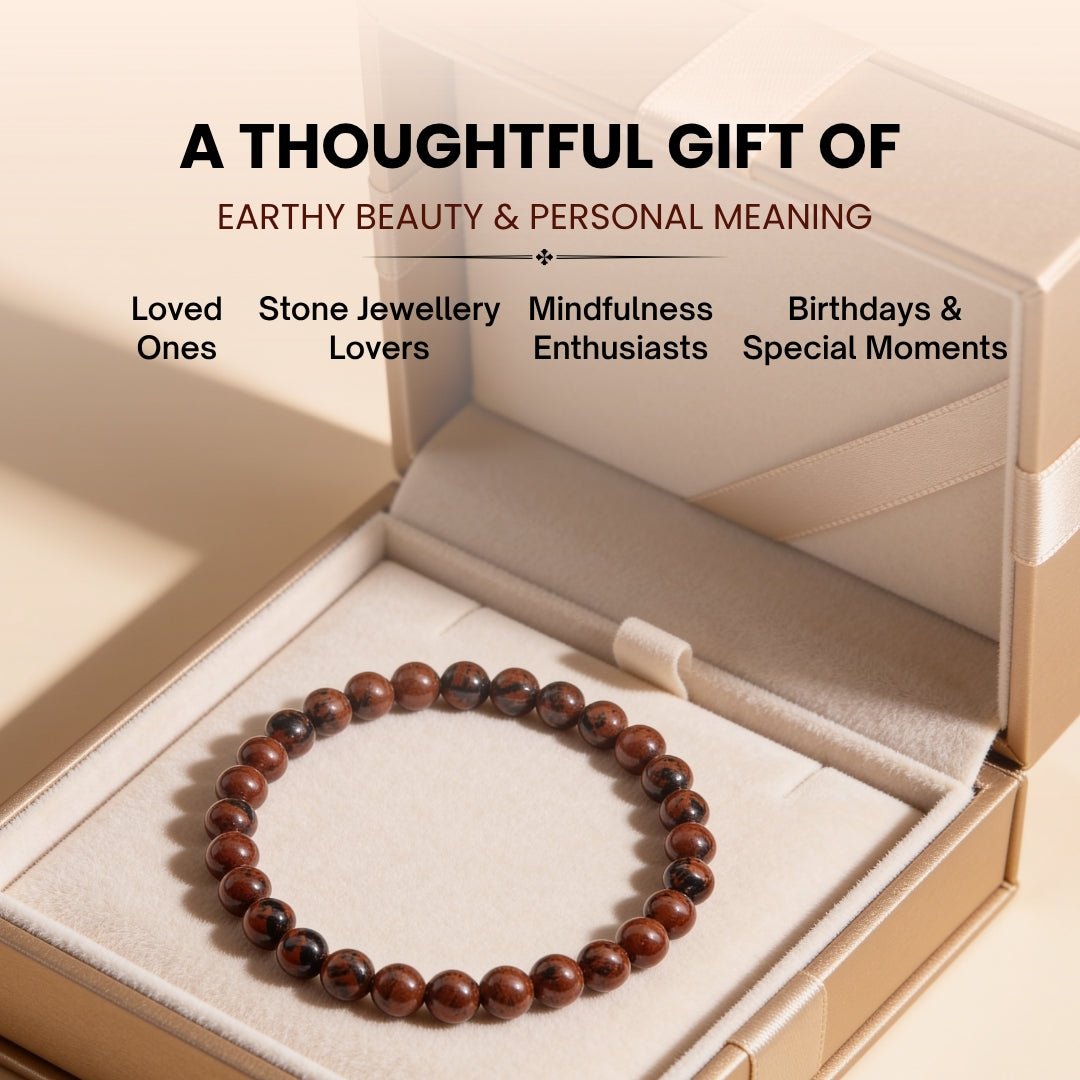 Natural volcanic glass sheen reflecting off smooth polished Mahogany Obsidian beads