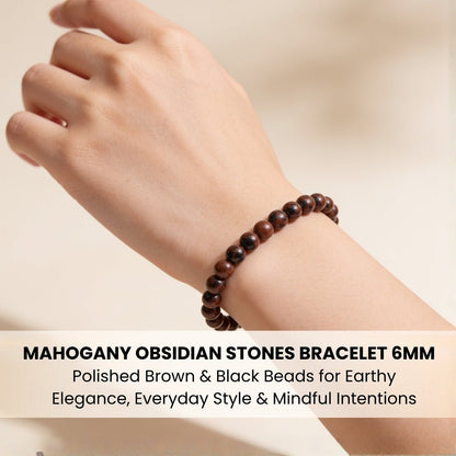 Dainty 6 mm Mahogany Obsidian bead bracelet worn on wrist for sizing reference and stacking style