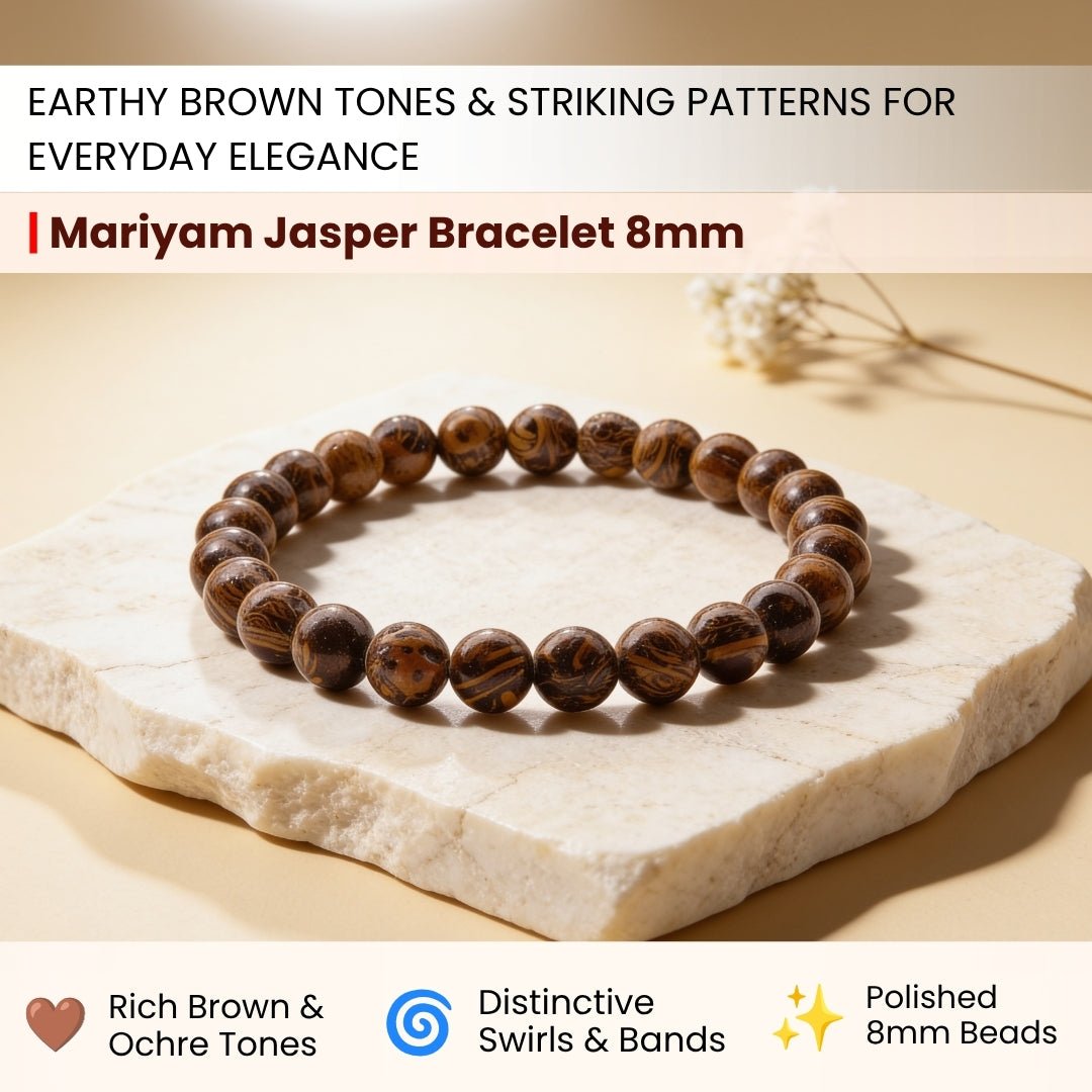 Close-up of 8 mm Mariyam Jasper beads showing distinct fossilized calligraphy script patterns in brown, tan, and ochre