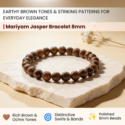 Close-up of 8 mm Mariyam Jasper beads showing distinct fossilized calligraphy script patterns in brown, tan, and ochre