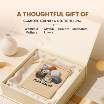 Assortment of smooth tumbled menopause support stones resting in palm demonstrating handheld scale, ergonomic shape, and tactile finish