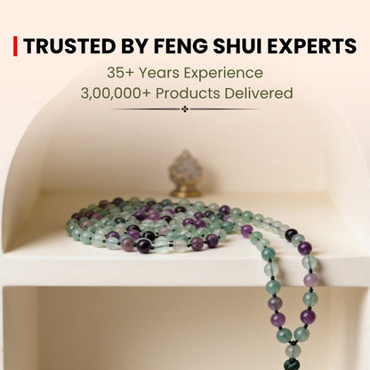 Substantial 108 bead Multi Fluorite 10 mm necklace draped on chest showing statement length and colorful crystal glow