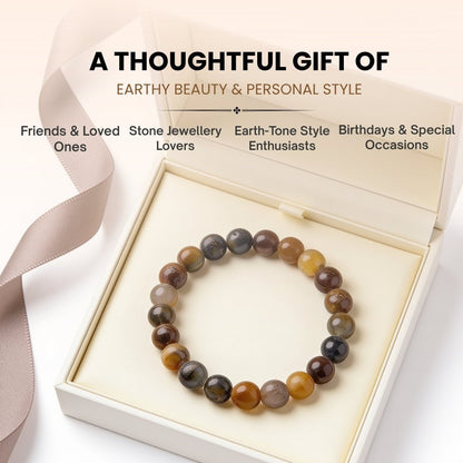 Silky chatoyant sheen and natural mineral flash reflecting off smooth Multi Pietersite beads