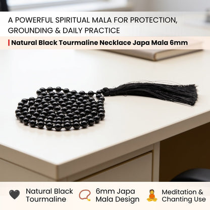 Black tourmaline mala detail showing the guru bead and the strand