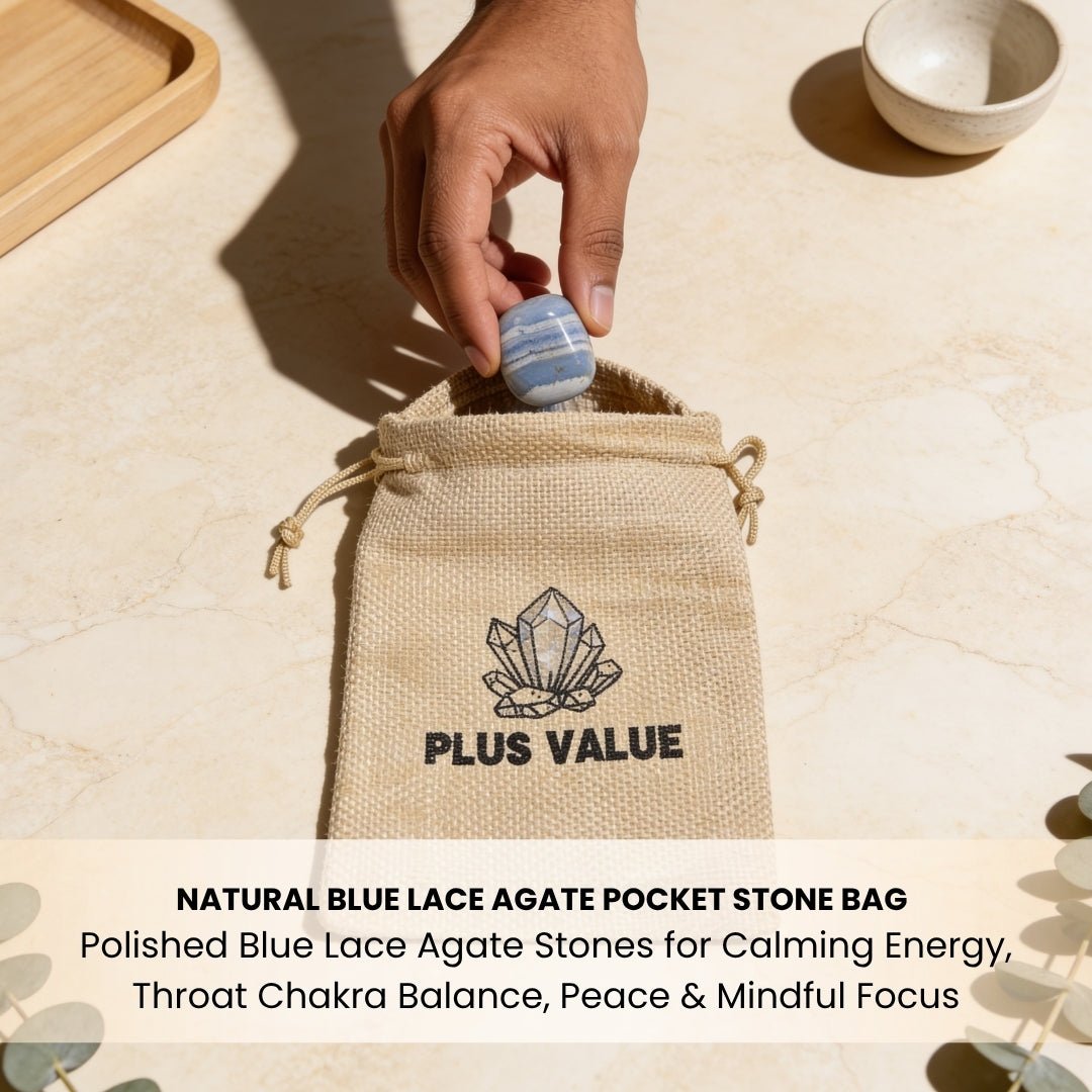 Blue Lace Agate pocket stone resting on a wooden office desk next to a pen and journal to promote calm self-expression