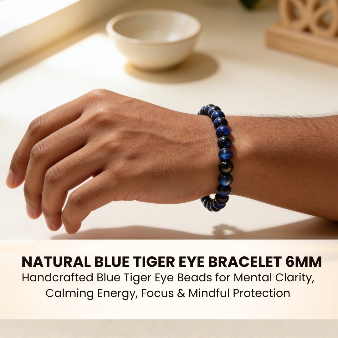 Blue Tiger Eye bracelet styled alongside a minimalist watch and notebook on a wooden desk to reduce work tension and improve focus