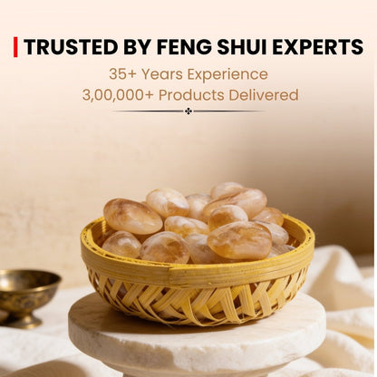 Natural Citrine pebbles in woven basket placed in south-east wealth corner of office or home for prosperity