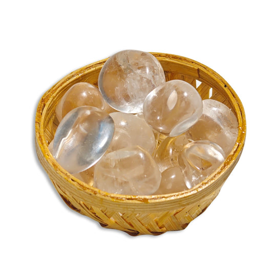 Natural Clear Quartz tumbled stone pebbles 200g arranged in a mini decorative woven basket