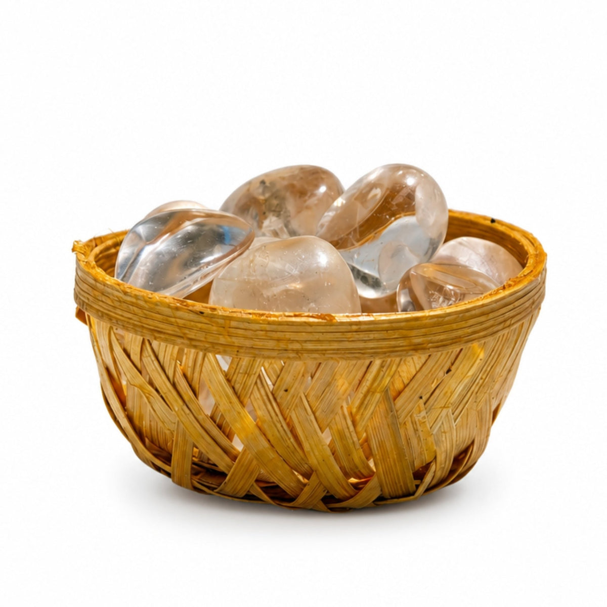 Close-up of polished natural Clear Quartz pebbles showing icy translucent clarity, internal veil inclusions, and glassy shine
