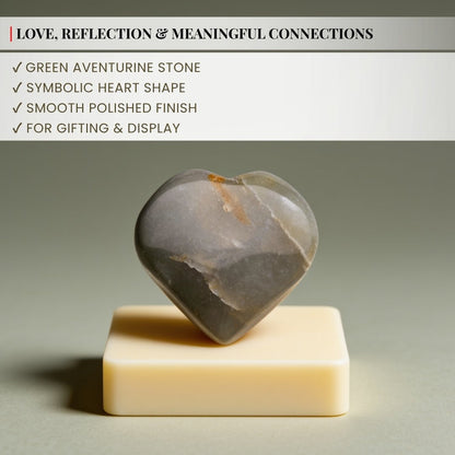 Smoothly rounded contours and hand-polished puffy edges of Green Aventurine carved heart crystal