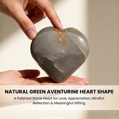 Green Aventurine pocket heart resting in palm demonstrating size, grip comfort, and worry stone utility