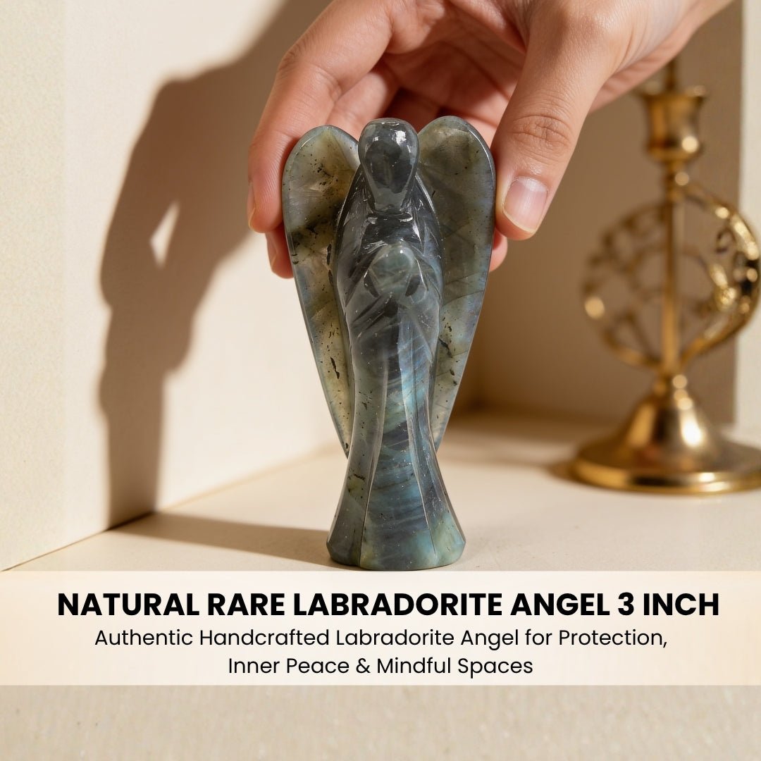3 inch Labradorite carved angel standing upright in palm showing handheld size and balanced base