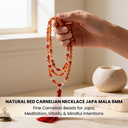 Hand-polished Carnelian guru bead with matching bright orange-red hanging tassel finish