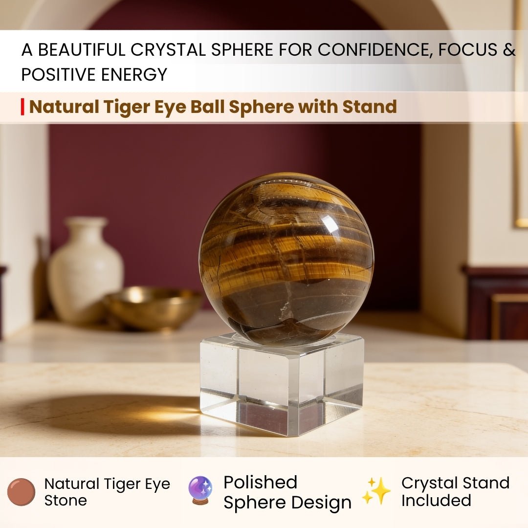 Tiger eye sphere held in the hand for scale, showing the band shift as it turns