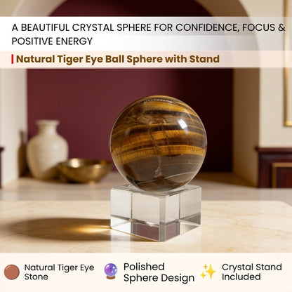 Tiger eye sphere held in the hand for scale, showing the band shift as it turns