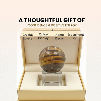 tiger eye ball sphere shown in hand for scale