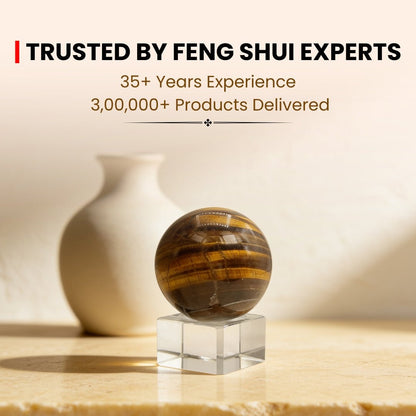 tiger eye sphere with stand displayed on an office work desk