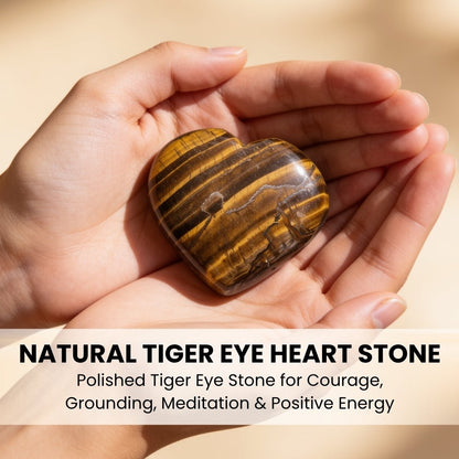 Polished Tiger Eye pocket heart held in hand demonstrating palm stone grip and thumb indent for worry relief