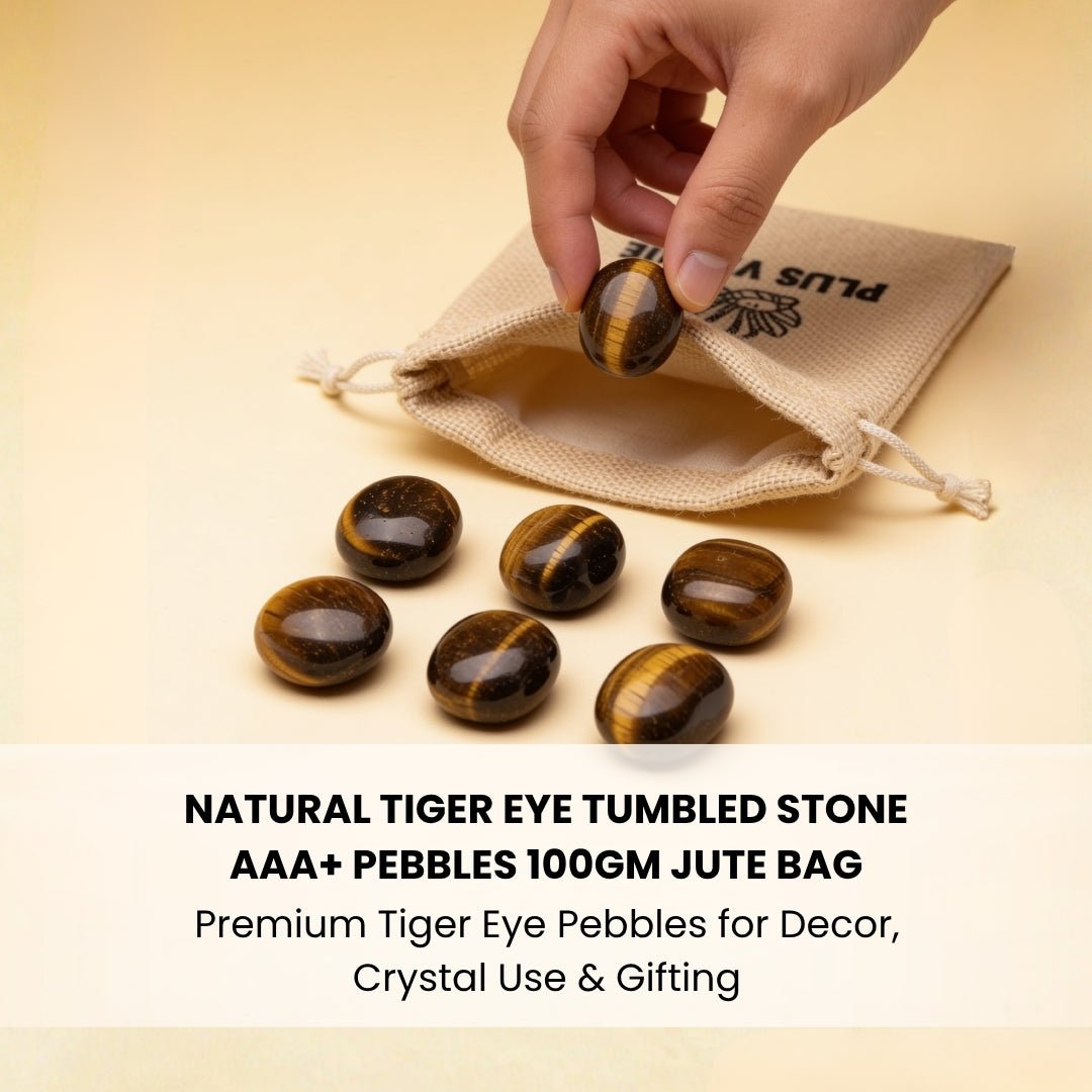 natural tiger eye tumbled pebble held in hand for size reference