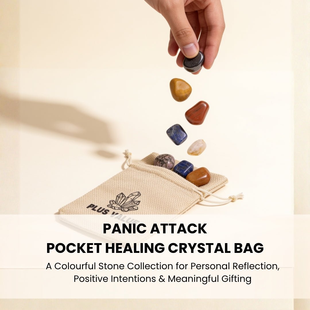 Hand holding smooth polished worry stones demonstrating tactile palm-size comfort for grounding during anxious moments