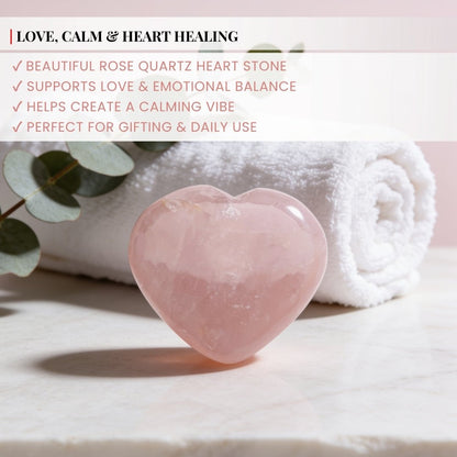 rose quartz heart stone held in hand for size reference