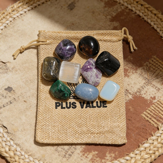 Curated psychic defence crystal bag featuring Black Tourmaline, Amethyst, Labradorite, Selenite, and Tiger Eye tumbled stones