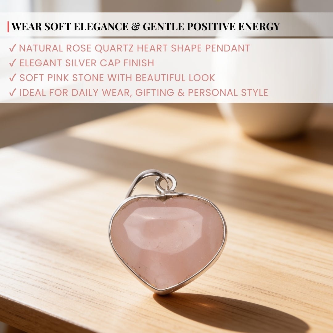 rose quartz heart pendant shown in hand for scale